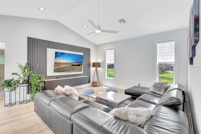 5285 Far Oak Cir, Sarasota, FL 34238 - living area featuring light wood-style flooring, lofted ceiling, healthy amount of natural light, ceiling fan, and baseboards