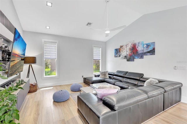 5285 Far Oak Cir, Sarasota, FL 34238 - living room with vaulted ceiling, wood finished floors, ceiling fan, and baseboards