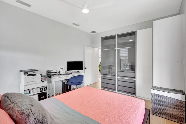 5285 Far Oak Cir, Sarasota, FL 34238 - bedroom featuring light wood-type flooring and ceiling fan