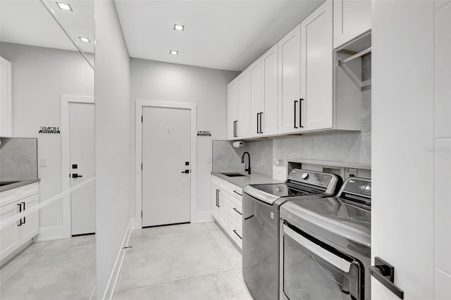 5285 Far Oak Cir, Sarasota, FL 34238 - washroom featuring cabinet space, washer and dryer, baseboards, and recessed lighting