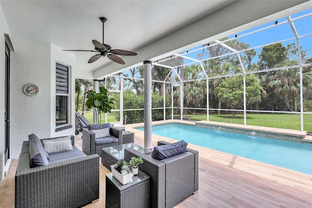 5285 Far Oak Cir, Sarasota, FL 34238 - swimming pool with an outdoor living space, a wooden deck, view of wooded area, ceiling fan, and glass enclosure