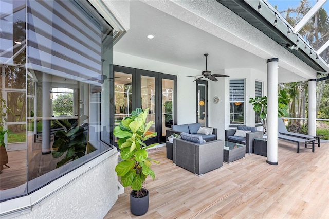 5285 Far Oak Cir, Sarasota, FL 34238 - wooden deck with an outdoor living space, a ceiling fan, and french doors