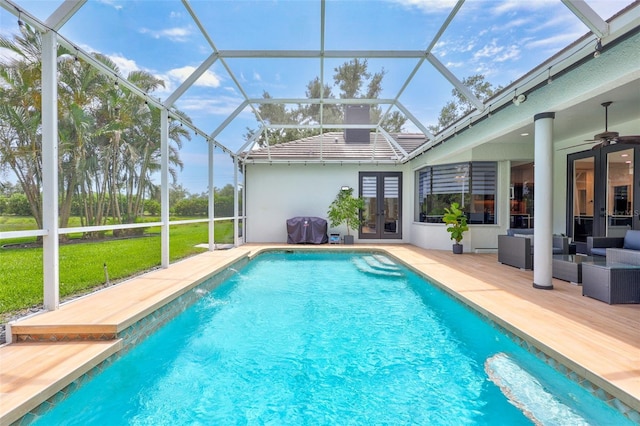 5285 Far Oak Cir, Sarasota, FL 34238 - swimming pool featuring french doors, a lawn, an outdoor hangout area, a patio, and ceiling fan