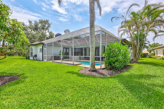 5285 Far Oak Cir, Sarasota, FL 34238 - rear view of house featuring a yard, an outdoor pool, a chimney, and a lanai