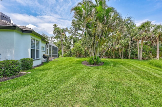 5285 Far Oak Cir, Sarasota, FL 34238 - view of grassy yard featuring glass enclosure
