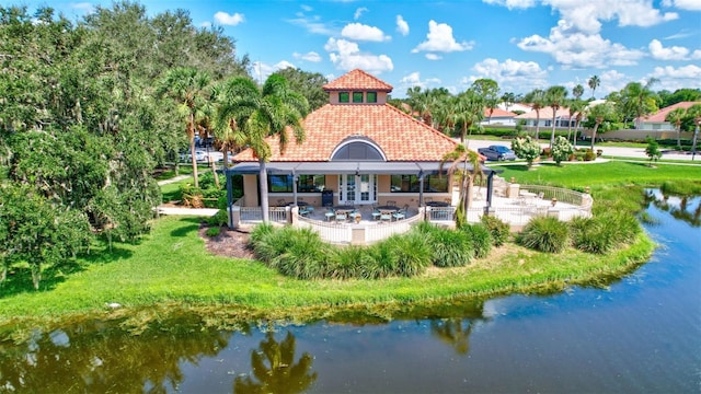 5285 Far Oak Cir, Sarasota, FL 34238 - rear view of house featuring a patio area, a tiled roof, french doors, and a water view