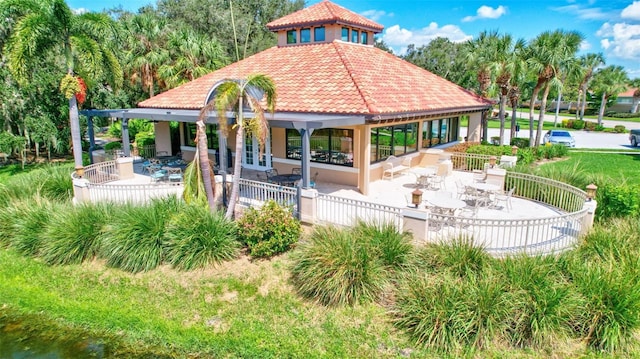 5285 Far Oak Cir, Sarasota, FL 34238 - back of house featuring a patio area, a tile roof, and stucco siding