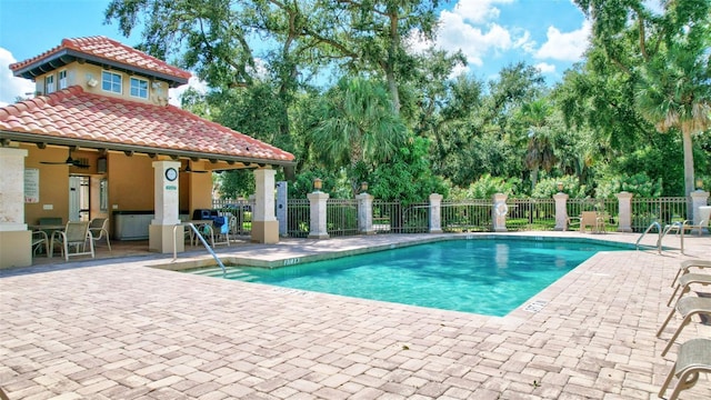 5285 Far Oak Cir, Sarasota, FL 34238 - community pool featuring a patio area and ceiling fan