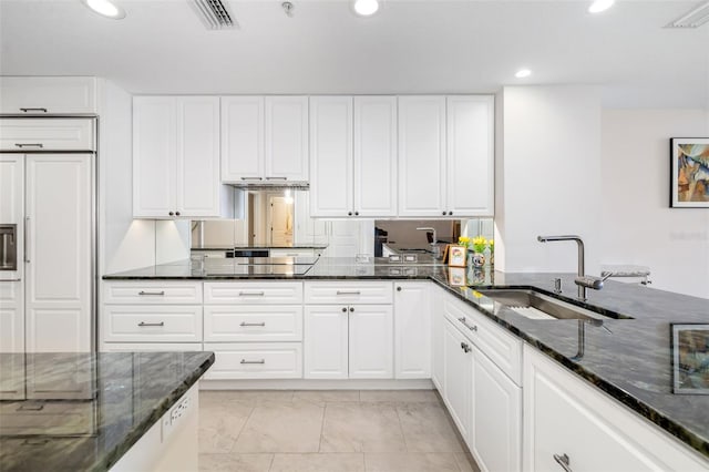 610 Riviera Dunes Way Unit 503, Palmetto, FL 34221 - kitchen featuring a sink, recessed lighting, dark stone countertops, and light marble finish flooring