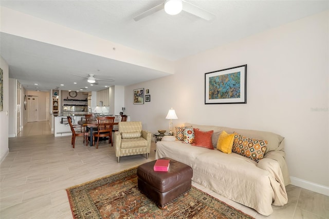 610 Riviera Dunes Way Unit 503, Palmetto, FL 34221 - living area with a ceiling fan and baseboards