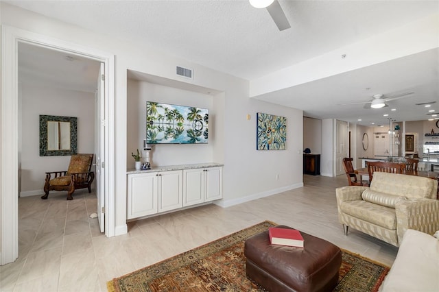 610 Riviera Dunes Way Unit 503, Palmetto, FL 34221 - living area with ceiling fan and baseboards