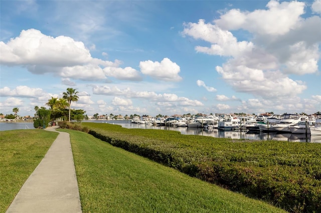 610 Riviera Dunes Way Unit 503, Palmetto, FL 34221 - dock with a water view and a lawn