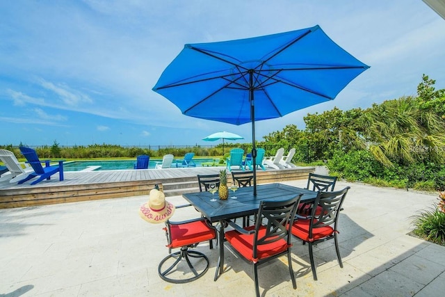 102 77th St, Holmes Beach, FL 34217 - view of patio with outdoor dining space and a pool