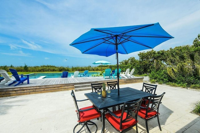102 77th St, Holmes Beach, FL 34217 - view of patio with a pool and outdoor dining space