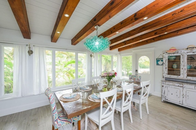 102 77th St, Holmes Beach, FL 34217 - sunroom / solarium with plenty of natural light, wood finished floors, beam ceiling, and baseboards