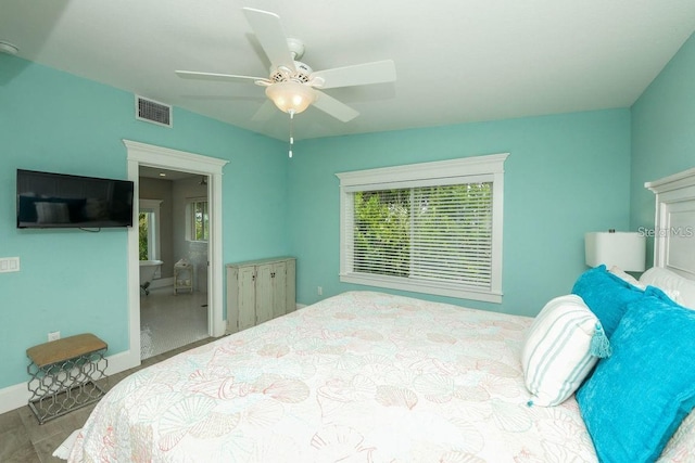 102 77th St, Holmes Beach, FL 34217 - bedroom with wood finished floors, a ceiling fan, and baseboards