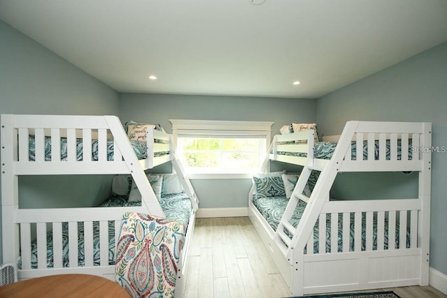 102 77th St, Holmes Beach, FL 34217 - bedroom featuring wood finished floors, baseboards, and recessed lighting