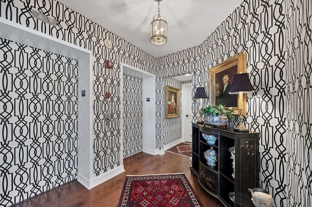 401 N Point Rd Unit 504, Osprey, FL 34229 - entryway featuring wood finished floors, baseboards, and wallpapered walls