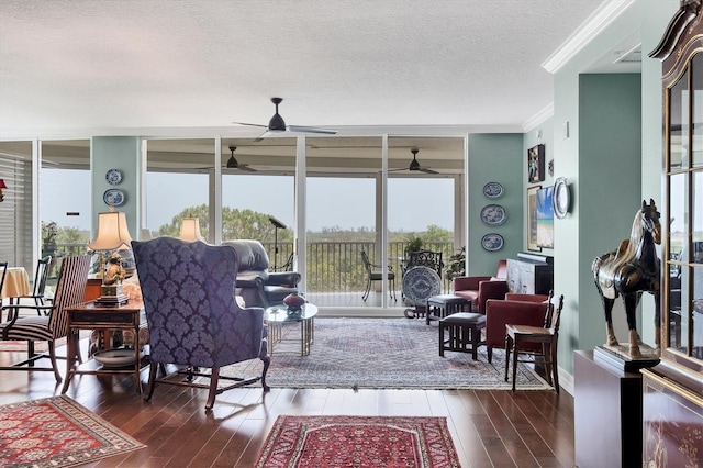 401 N Point Rd Unit 504, Osprey, FL 34229 - living area with ornamental molding, hardwood / wood-style flooring, a textured ceiling, healthy amount of natural light, and a ceiling fan