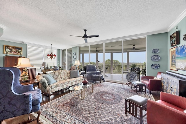 401 N Point Rd Unit 504, Osprey, FL 34229 - living area featuring crown molding, a ceiling fan, a textured ceiling, and wood finished floors