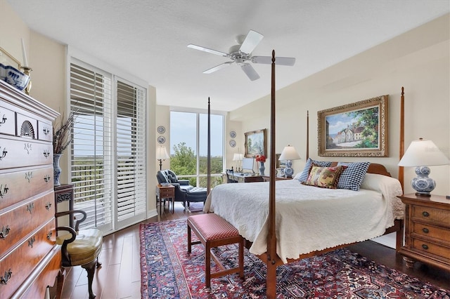 401 N Point Rd Unit 504, Osprey, FL 34229 - bedroom with access to outside, floor to ceiling windows, a ceiling fan, and wood finished floors