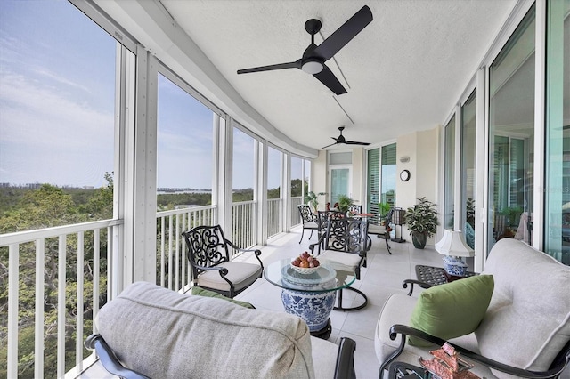 401 N Point Rd Unit 504, Osprey, FL 34229 - sunroom / solarium with tile patterned flooring, healthy amount of natural light, and a textured ceiling