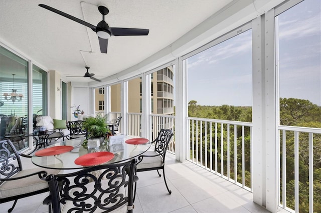 401 N Point Rd Unit 504, Osprey, FL 34229 - sunroom featuring a ceiling fan