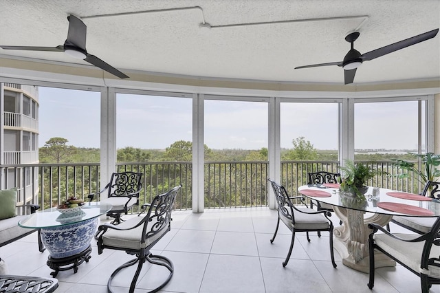 401 N Point Rd Unit 504, Osprey, FL 34229 - sunroom featuring tile patterned floors and a textured ceiling