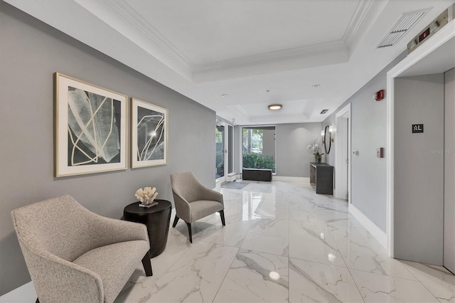 401 N Point Rd Unit 504, Osprey, FL 34229 - corridor featuring a tray ceiling, baseboards, light marble finish flooring, and ornamental molding