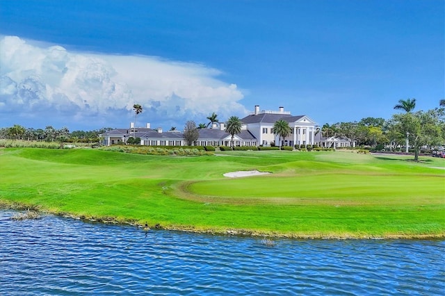 401 N Point Rd Unit 504, Osprey, FL 34229 - view of community featuring a water view, a lawn, and view of golf course