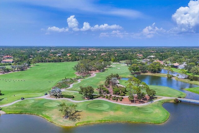 401 N Point Rd Unit 504, Osprey, FL 34229 - aerial view of a local golf course, a nearby body of water, and a tree filled landscape