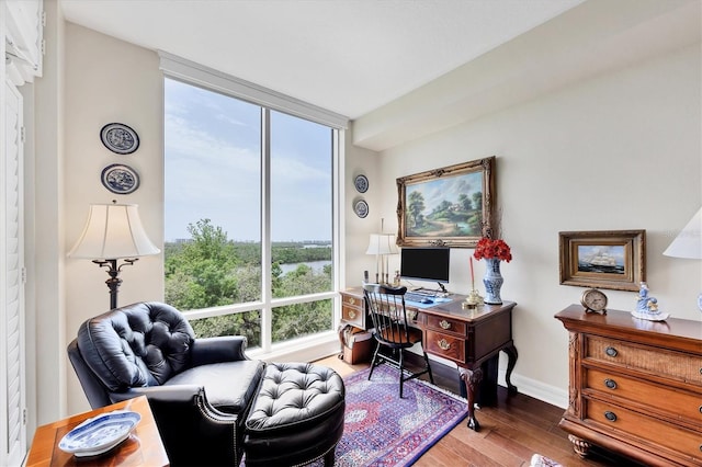 401 N Point Rd Unit 504, Osprey, FL 34229 - office area featuring wood finished floors and baseboards