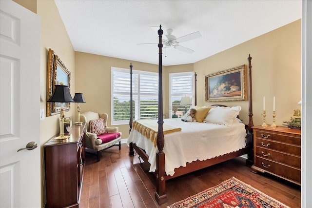 401 N Point Rd Unit 504, Osprey, FL 34229 - bedroom with dark wood finished floors, ceiling fan, and baseboards