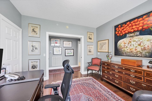 401 N Point Rd Unit 504, Osprey, FL 34229 - home office with wood finished floors, baseboards, and a textured ceiling