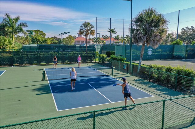 401 N Point Rd Unit 504, Osprey, FL 34229 - view of tennis court with community basketball court