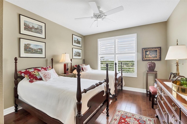 401 N Point Rd Unit 504, Osprey, FL 34229 - bedroom featuring baseboards, dark wood-type flooring, and ceiling fan