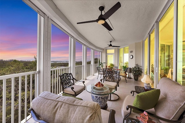 401 N Point Rd Unit 504, Osprey, FL 34229 - sunroom featuring tile patterned flooring, a textured ceiling, and healthy amount of natural light