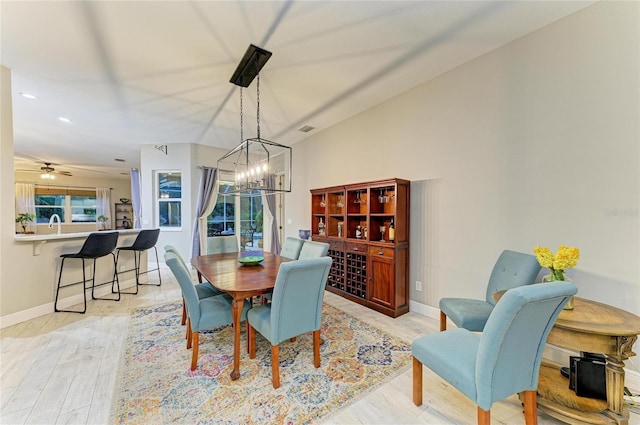 12175 Maple Ridge Dr, Parrish, FL 34219 - dining area with a chandelier, light wood-style flooring, and recessed lighting