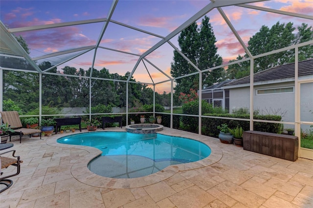 12175 Maple Ridge Dr, Parrish, FL 34219 - pool at dusk featuring a patio, a pool with connected hot tub, and a lanai