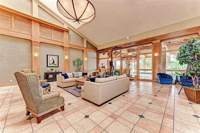 12175 Maple Ridge Dr, Parrish, FL 34219 - living area featuring vaulted ceiling and light tile patterned floors