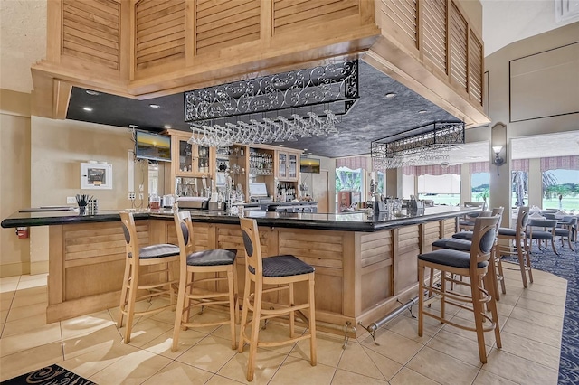 12175 Maple Ridge Dr, Parrish, FL 34219 - bar area featuring light tile patterned floors