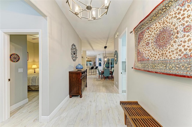 12175 Maple Ridge Dr, Parrish, FL 34219 - hall with a chandelier and wood finished floors