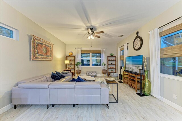 12175 Maple Ridge Dr, Parrish, FL 34219 - living area with ceiling fan and light wood-style flooring