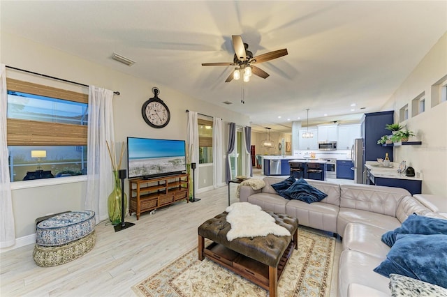 12175 Maple Ridge Dr, Parrish, FL 34219 - living area featuring ceiling fan, light wood finished floors, and recessed lighting