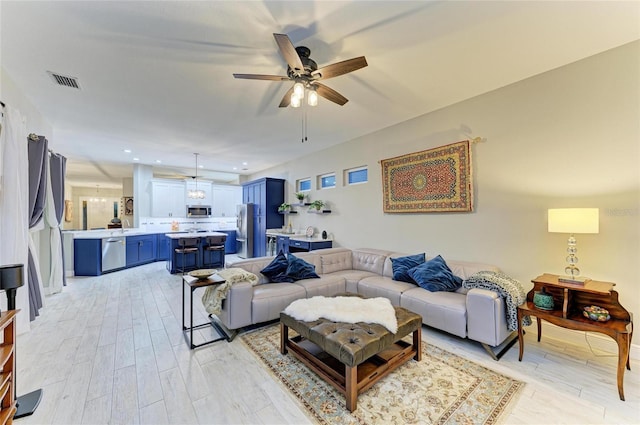 12175 Maple Ridge Dr, Parrish, FL 34219 - living area with a ceiling fan, light wood-type flooring, and recessed lighting