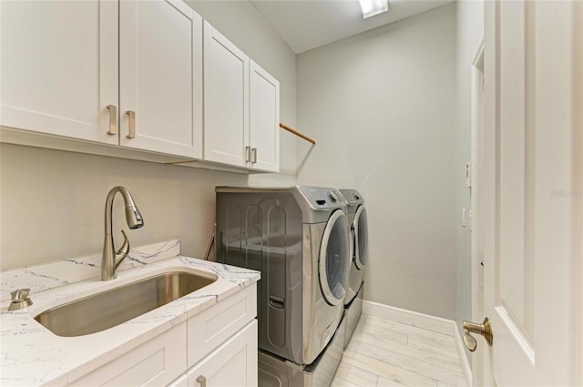 12175 Maple Ridge Dr, Parrish, FL 34219 - laundry area with separate washer and dryer, cabinet space, and light wood-type flooring