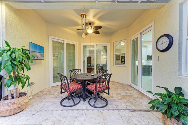 12175 Maple Ridge Dr, Parrish, FL 34219 - sunroom featuring ceiling fan and outdoor dining area