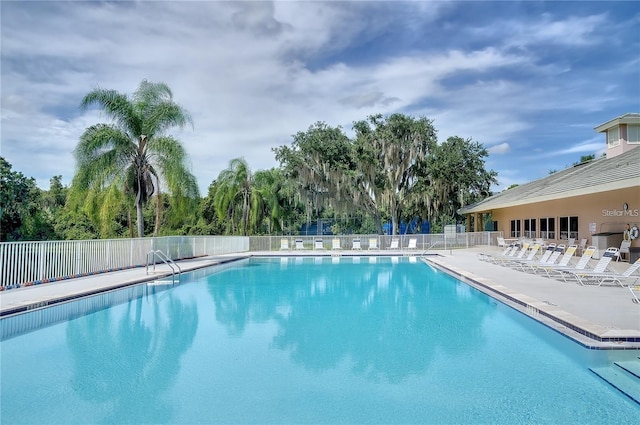 12175 Maple Ridge Dr, Parrish, FL 34219 - community pool with a patio and view of wooded area