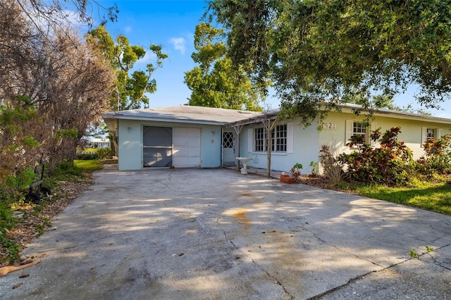 1921 Fairview Dr, Englewood, FL 34223 - ranch-style house featuring concrete driveway, a garage, and stucco siding