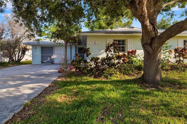 1921 Fairview Dr, Englewood, FL 34223 - single story home with stucco siding, concrete driveway, and a garage